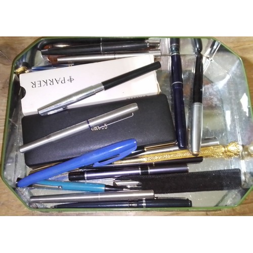 399 - A collection of pens and pencils to include three with 14ct gold nibs.