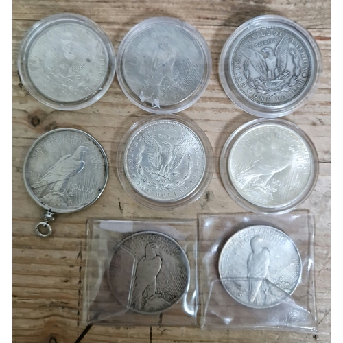 442 - A group of eight American one dollar coins (1884, 1889, 1921, 5 x 1923).