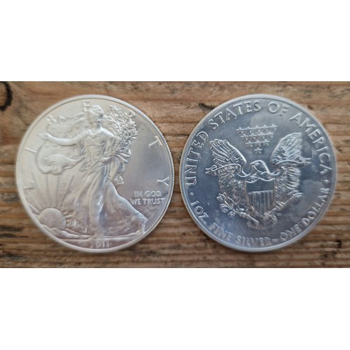 27 - A tray of assorted American coins to include silver dollars etc.