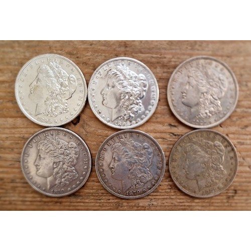 27 - A tray of assorted American coins to include silver dollars etc.