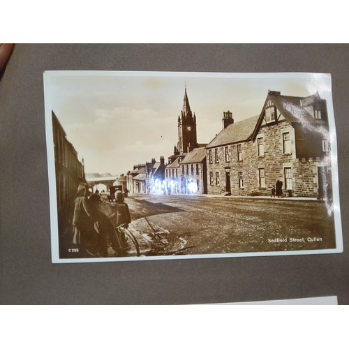 87 - A box containing early 20th century photopraphs and a collection of postcards.