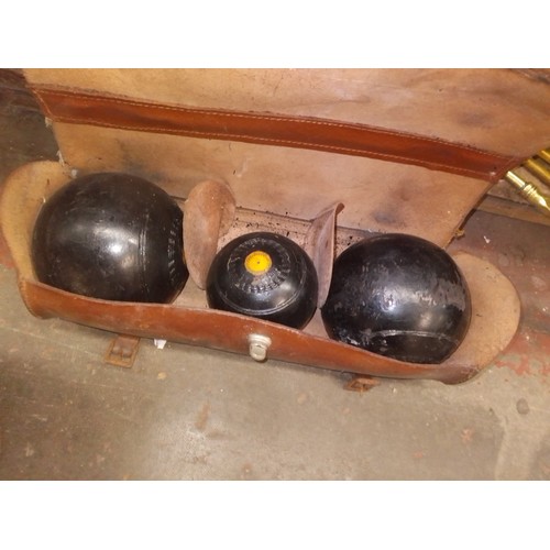 90 - A cased set of crown green bowls