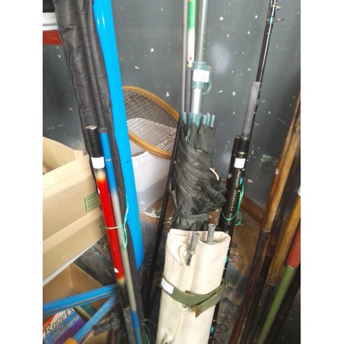 156 - A quantity of coarse and sea fishing tackle, incl: a camp bed & 2x graphite rods