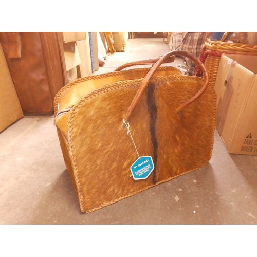 172 - A vintage reindeer hide travel bag with BOAC tag attached, together with a Swiss Army penknife