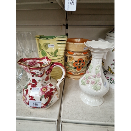 558 - Four ceramic vases/jugs; a Belleek vase, Mason's jug, Crown Ducal Charlotte Reid vase and a Burleigh... 