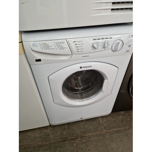 A Hotpoint Aquarius 5Kg washer dryer.