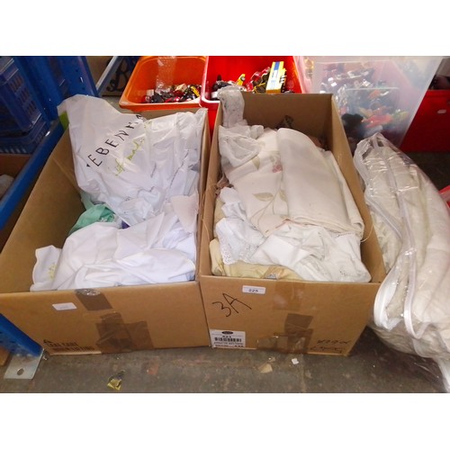 225 - 2 boxes containing a large quantity of linen, lace, bedsprea, cloth remnants etc