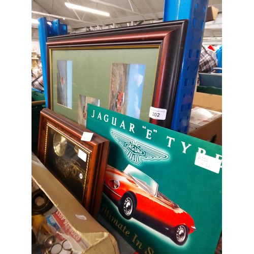 202 - A mixed lot comprising a framed The Postbus In Scotland landrover postcards, a Jaguar clock and repr... 