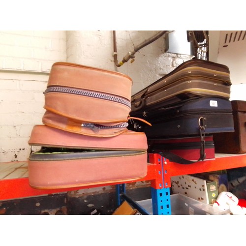 283 - A cased quarter size violin (AF) and four empty violin cases