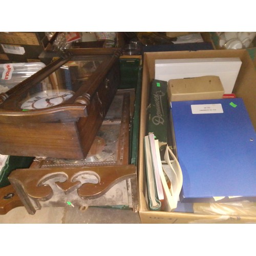 390 - A box of misc items - mainly stamps and albums. Some dominoes and books, together with a box of cloc... 