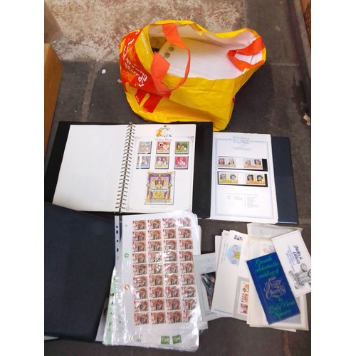 314 - A bag of assorted stamp albums.