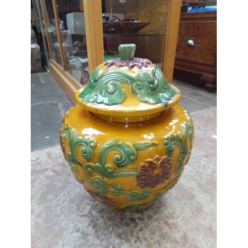 309 - A large chines pot and cover.