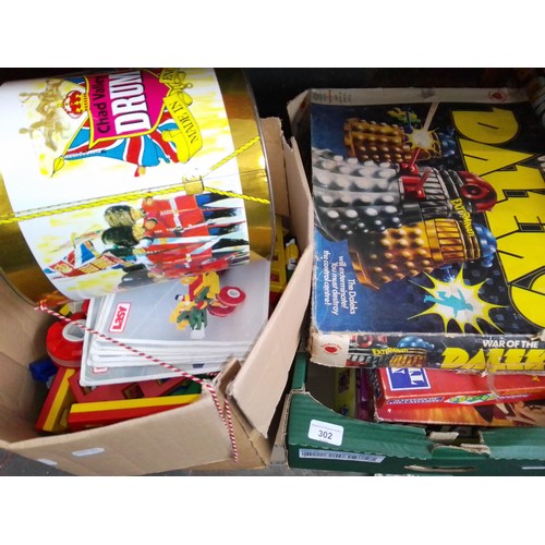 302 - 2 boxes containing a collection of vintage toys and games to include Lasy construction set, boards g... 