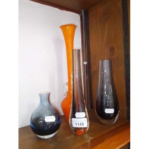 1148 - Three Caithness glass vases (two shadow blue and one brown) together with an orange art glass vase.