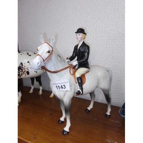 1143 - A Beswick horse and lady rider figure