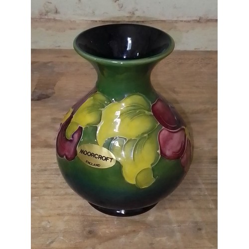 66 - A Moorcroft pottery vase, height 13cm.