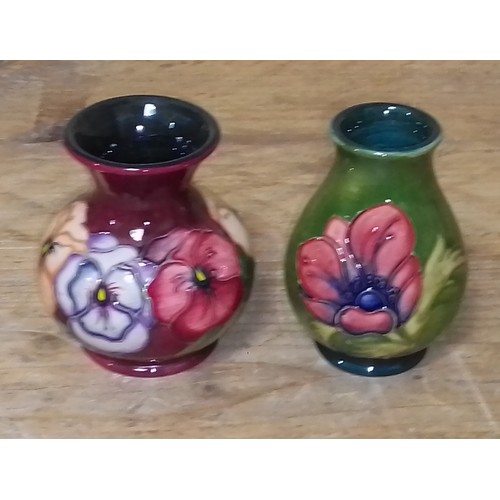 61 - Two Moorcroft pottery vases, height 9.5cm.