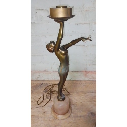 79 - An Art Deco gilt spelter lamp modelled as a semi nude female figure on alabaster base, height 55cm.