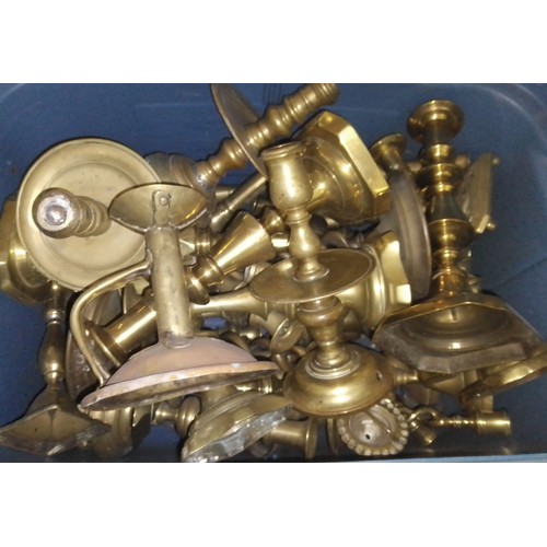 114 - A box of assorted brass candlesticks.