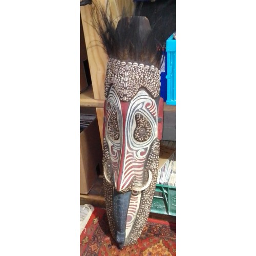 105 - An African tribal mask, length 99cm.