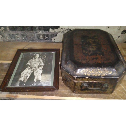 104 - A Chinese black lacquered and gilt decorated box together with a signed photograph.