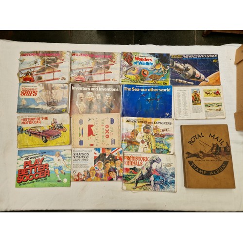 111 - A box of assorted stamps, cigarette cards etc.