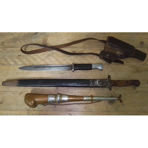 129 - Two bayonets, a pistol holster and a horn.