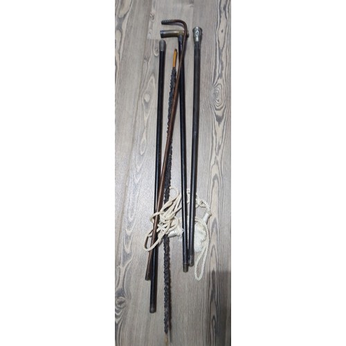 157 - A bundle of antique walking sticks to include with silver and white metal.