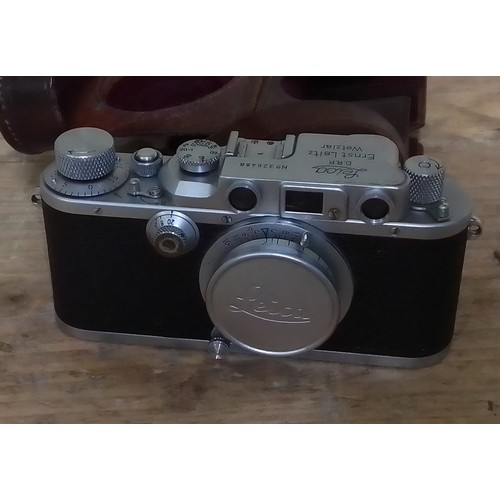 176 - A Leica I 35mm camera, circa 1930, serial no. 326488 with lens and leather case.