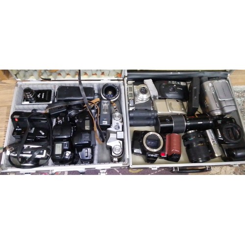 192 - Two cases of assorted cameras.