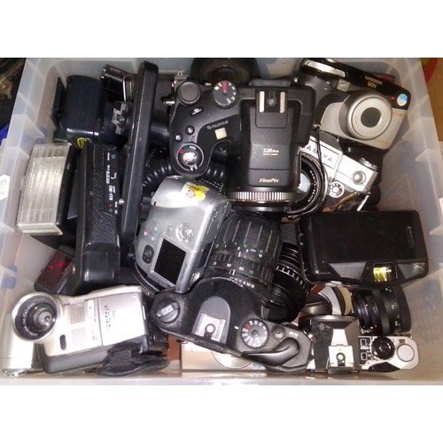 196 - A box of assorted cameras and accessories.