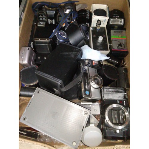 194 - A box of assorted cameras and accessories.