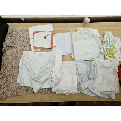 384 - Five boxes of vintage linen and lace.