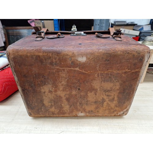 282 - An early 20th century leather top hat case by Herbert Johnson, Bond Street, London.