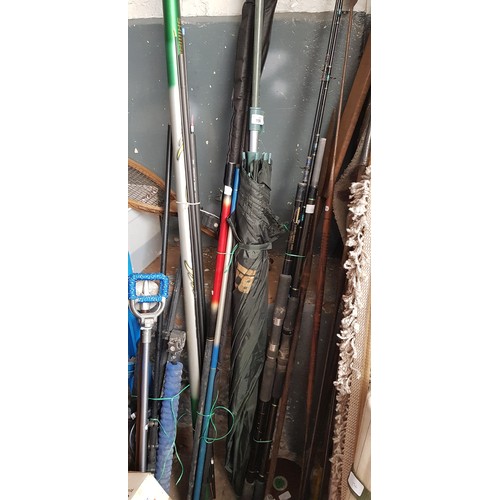 156 - A quantity of coarse and sea fishing tackle, incl: a camp bed & 2x graphite rods