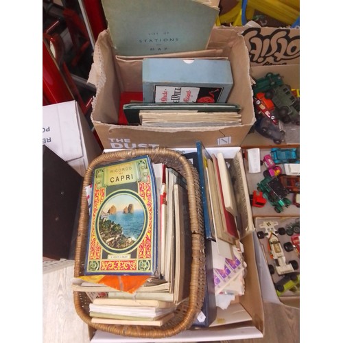 395 - A collection of postcards, souvenir booklets, FDCs, stamps and an album of various cigarette cards.