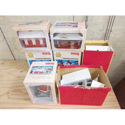 389 - A group of seven Piko Christmas G scale model railway buildings.