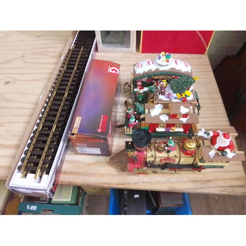 390 - G Scale model railway comprising two boxes of Piko track and a New Bright Father Christmas train.