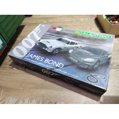 353 - A James Bond 007 Scalextric set with Aston Martins.