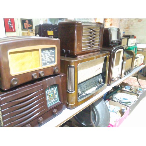 215 - A collection of twelve bakelite and vintage radios.