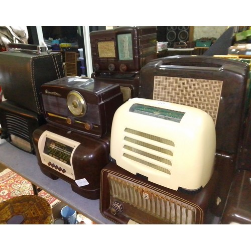 217 - A collection of twelve bakelite and vintage radios.