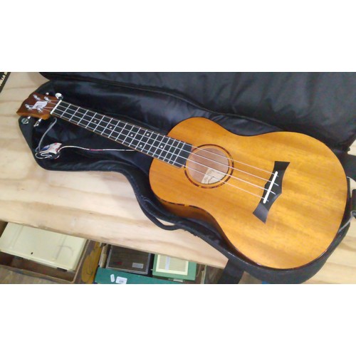 233 - A Snail tenor ukelele, model no. UKT 518, with soft bag.