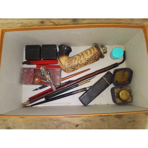 291 - A mixed lot comprising pipe, pens, travel inkwells, seal wax, a white metal seal modelled as a cheru... 