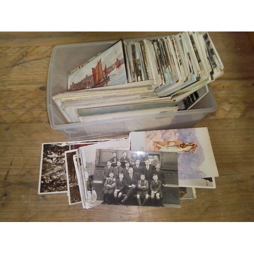 286 - A tub of postcards and photographs.