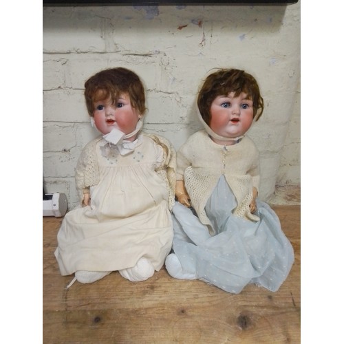 330 - Two Armand Marseille 990 bisque headed dolls.