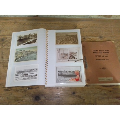 276 - A post card album and a stamp album.