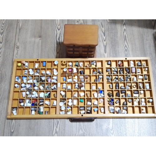 277 - A collection of approx. 200 various thimbles with display cases.