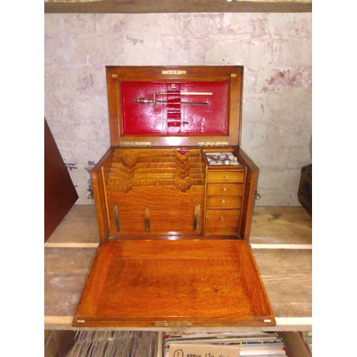 261 - An oak stationary writing box, circa 1900, domed top, brass carry handles to sides, drop down front ... 