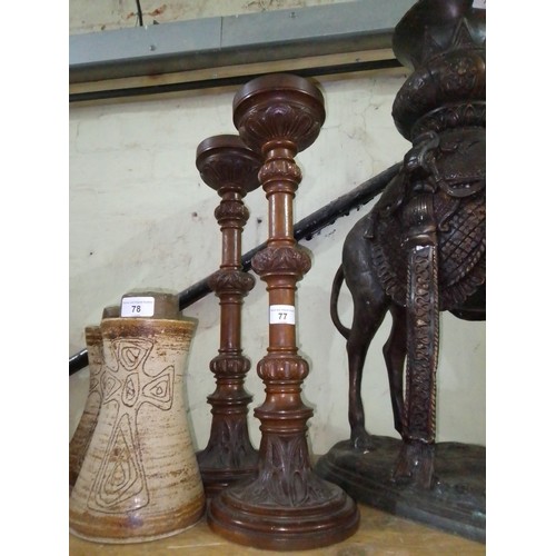 77 - A pair of carved oak church candlesticks, height 49.5cm.