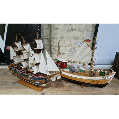 439 - Two wooden model boats; H.M.S. Endeavor and one other.